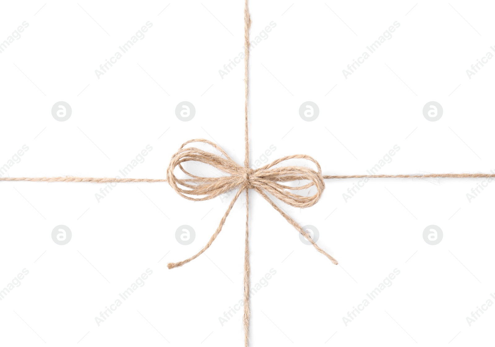 Photo of Linen rope string with bow isolated on white, top view