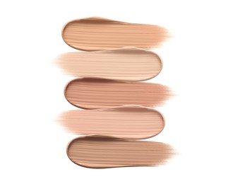 Image of Different shades of liquid skin foundation on white background, top view