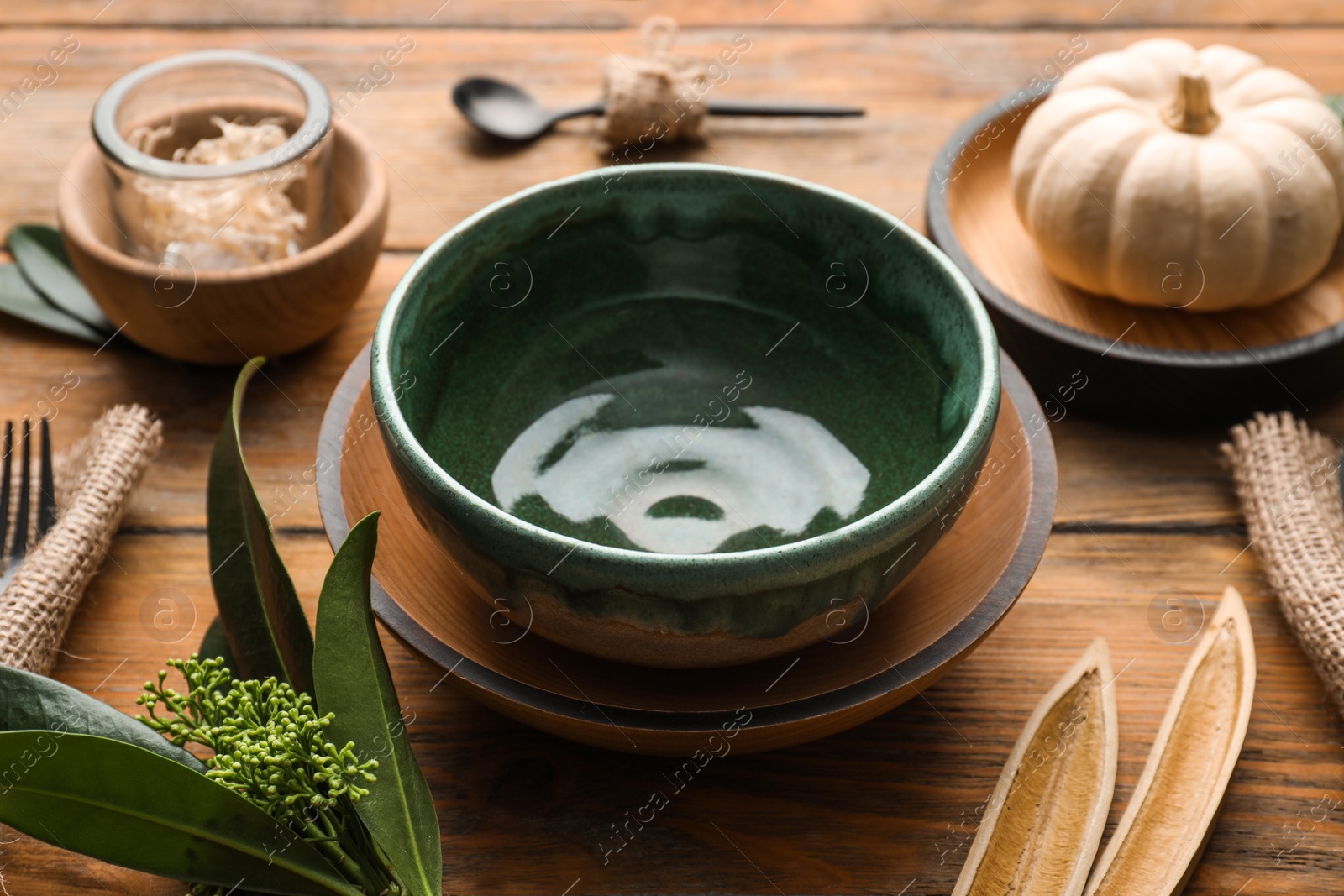 Photo of Autumn table setting with decor on wooden background