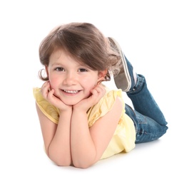 Happy little girl in casual outfit lying on white background