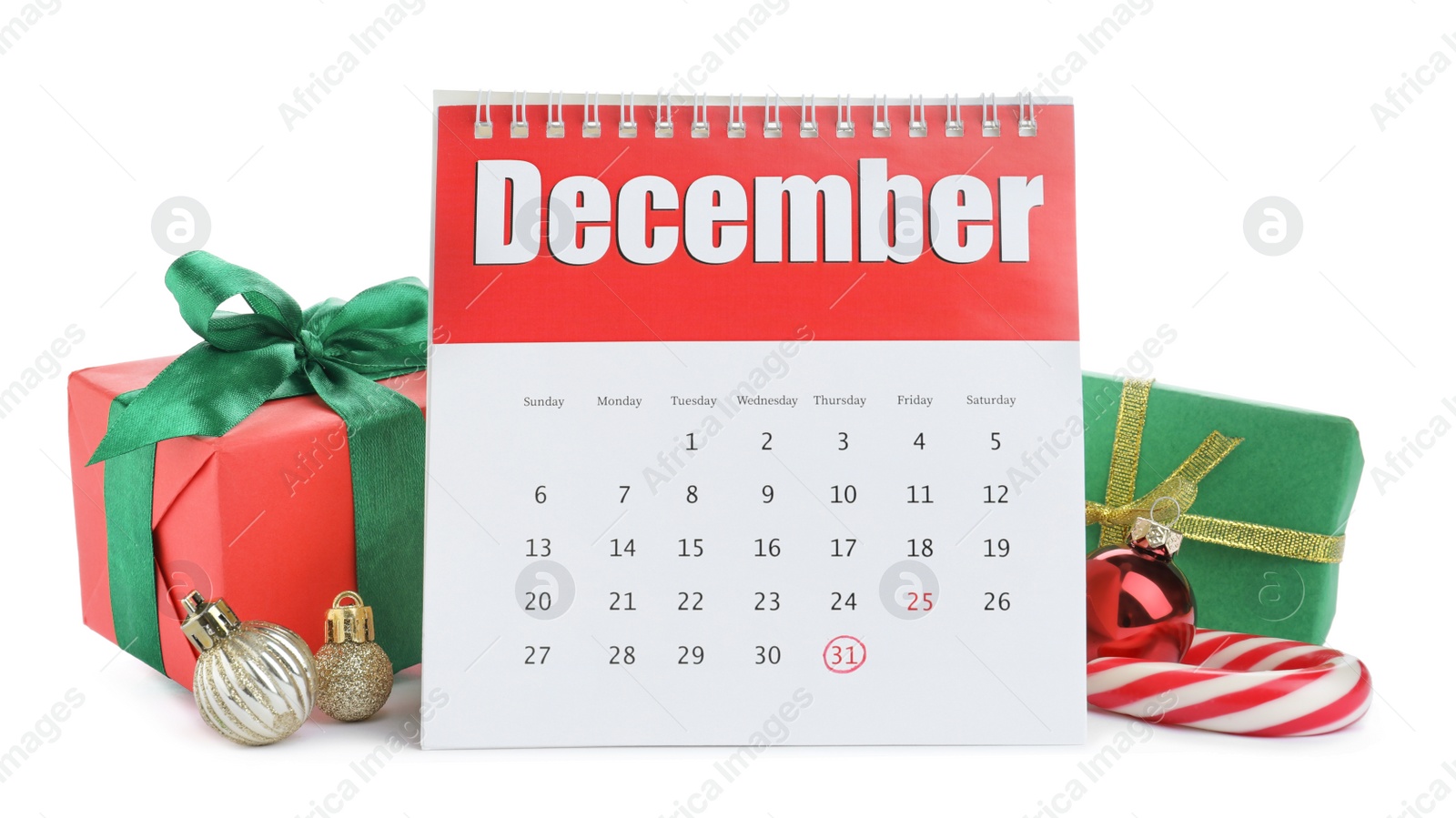 Photo of Flip calendar, gifts, Christmas balls and candy cane on white background. New Year countdown