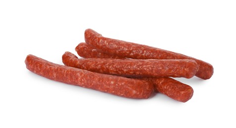 Photo of Thin dry smoked sausages isolated on white