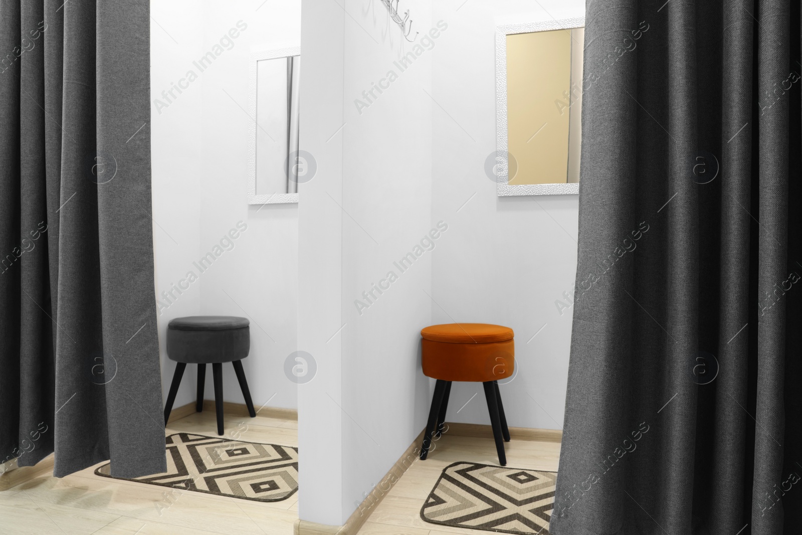 Photo of Empty dressing rooms in store. Stylish interior