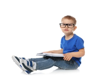 Photo of Little child with eyeglasses and book on white background