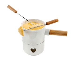 Photo of Pot of tasty cheese fondue and forks isolated on white