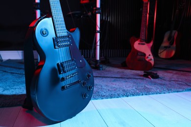 Photo of Electric guitar at recording studio, color toned. Music band practice