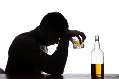 Photo of Silhouette of addicted man with alcoholic drink on white background