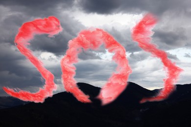 Image of Word SOS made of red smoke and view of cloudy sky over mountains