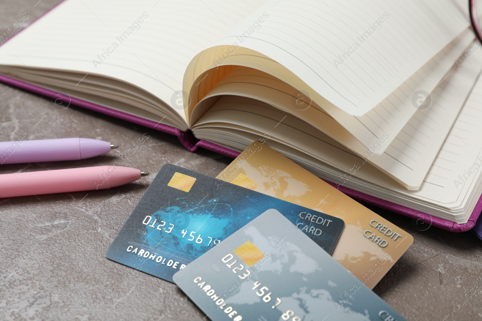 Photo of Credit cards and stationery on marble table