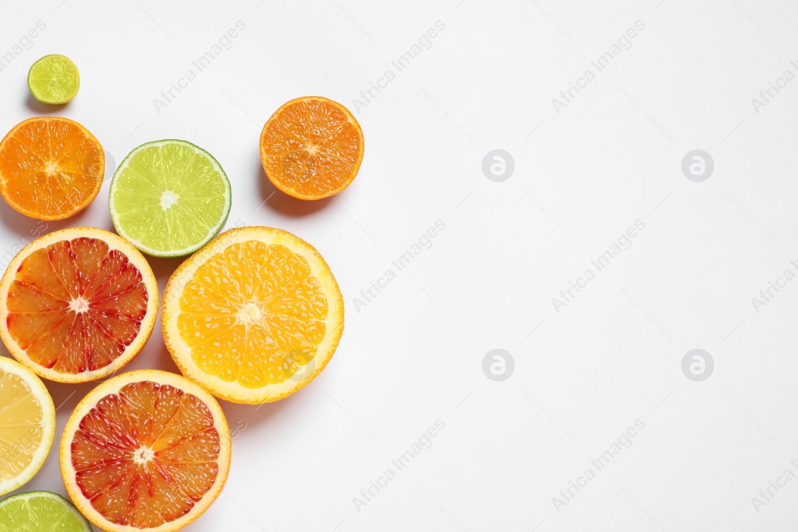 Photo of Composition with different citrus fruits on white background, top view