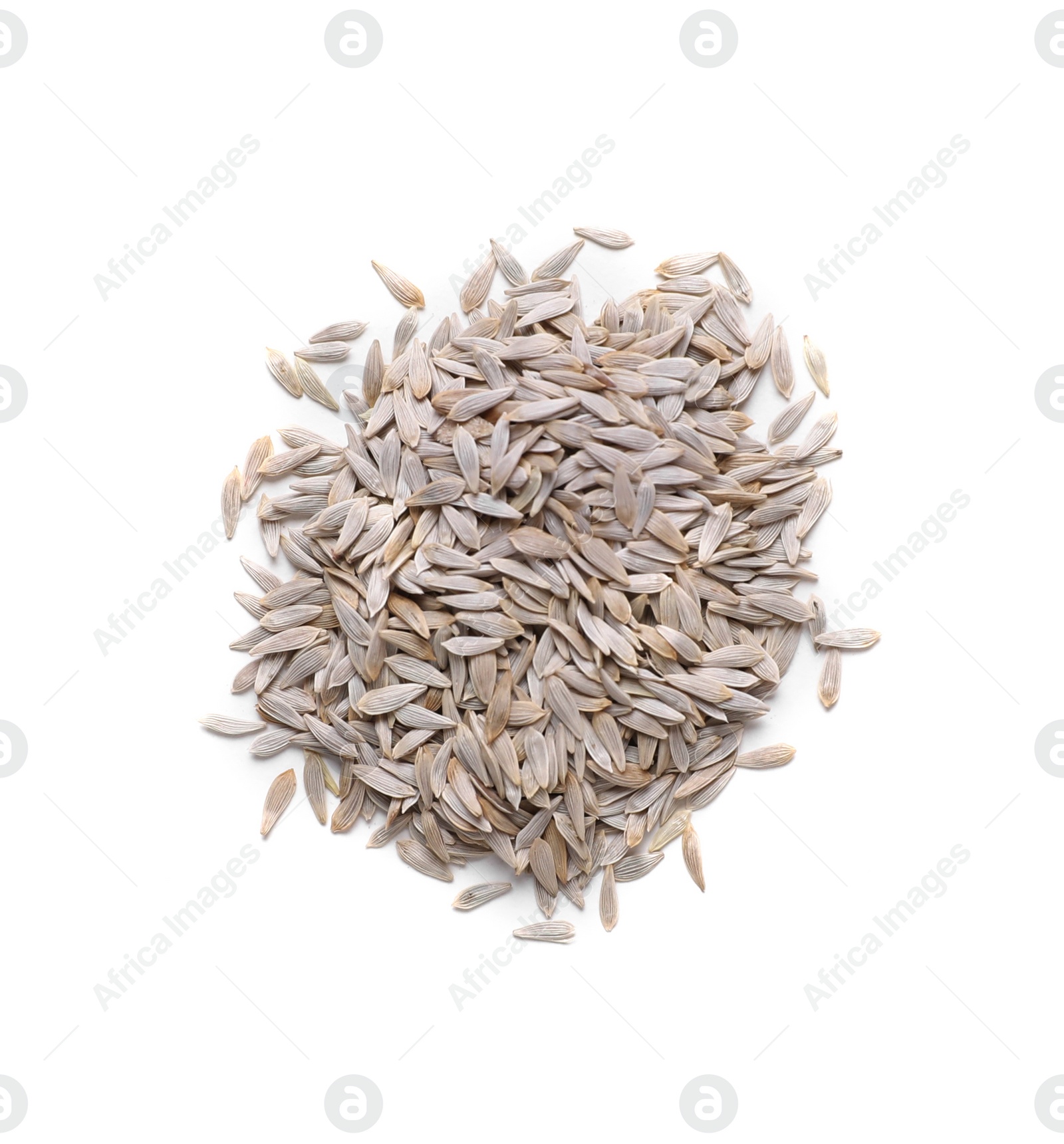 Photo of Pile of lettuce seeds on white background, top view