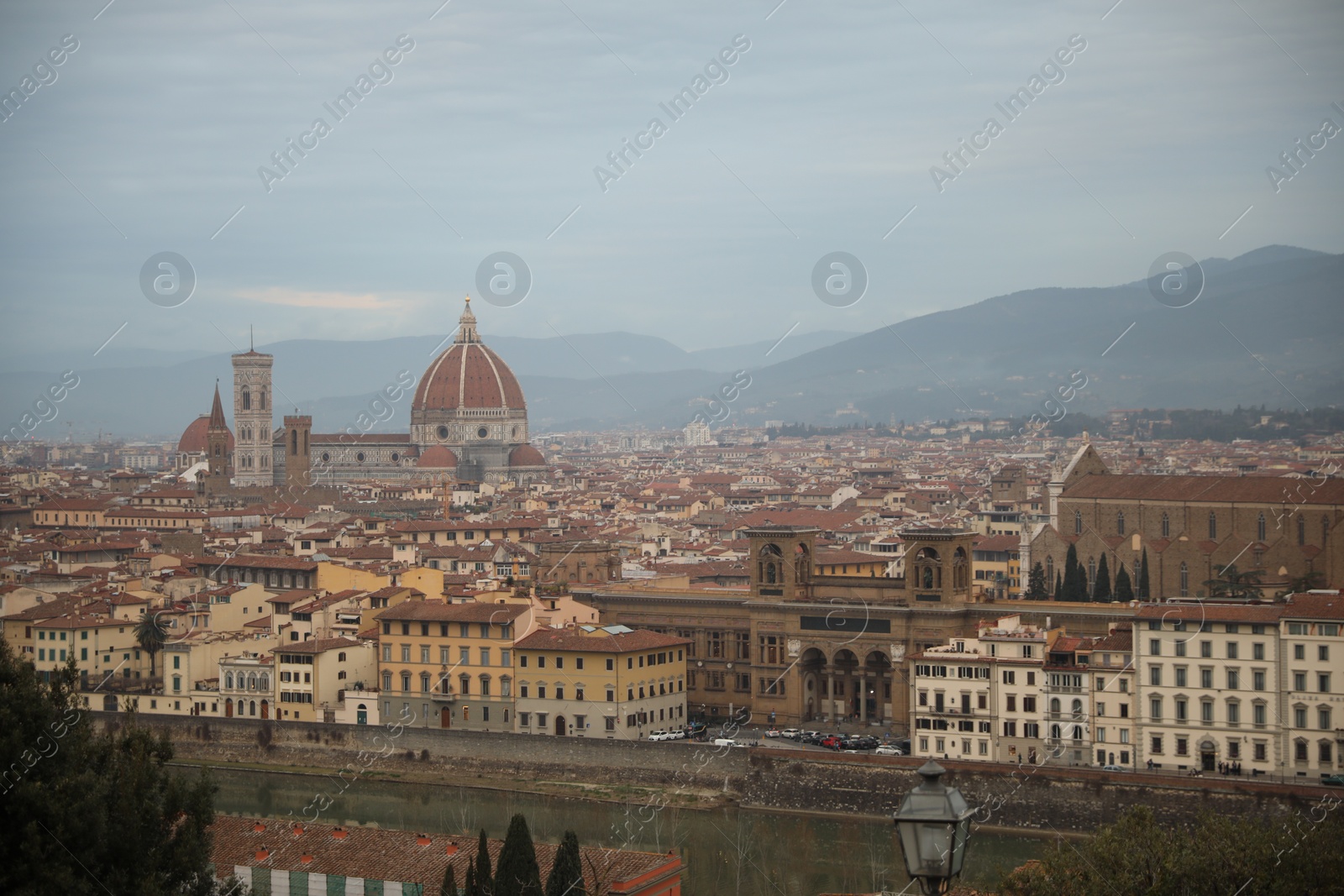 Photo of Florence, Italy - February 8, 2024: Picturesque view of city with beautiful buildings and mointains