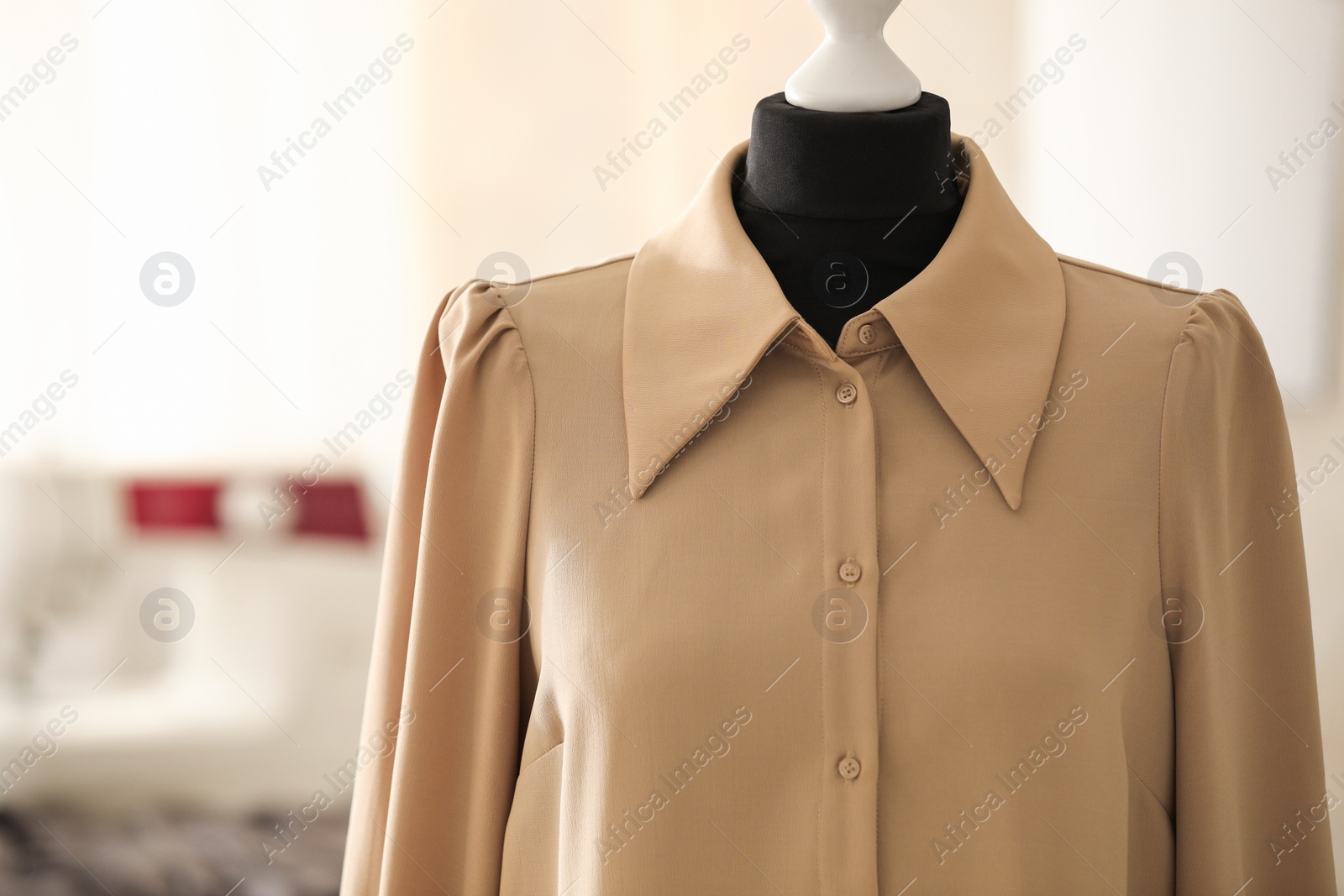 Photo of Mannequin with stylish shirt in tailor shop, space for text