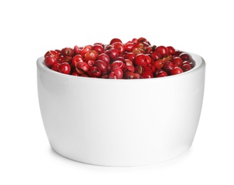 Photo of Bowl of red peppercorns isolated on white