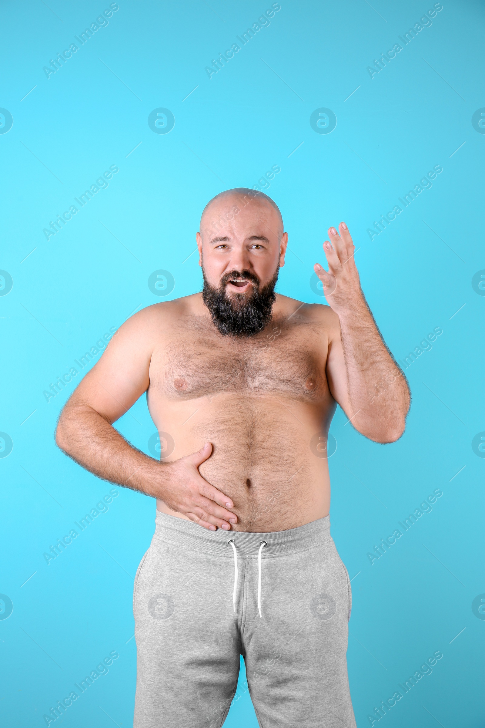 Photo of Fat man on color background. Weight loss