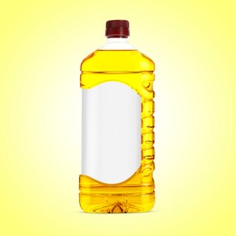 Image of Cooking oil in plastic bottle with empty label on light yellow background. Mockup for design