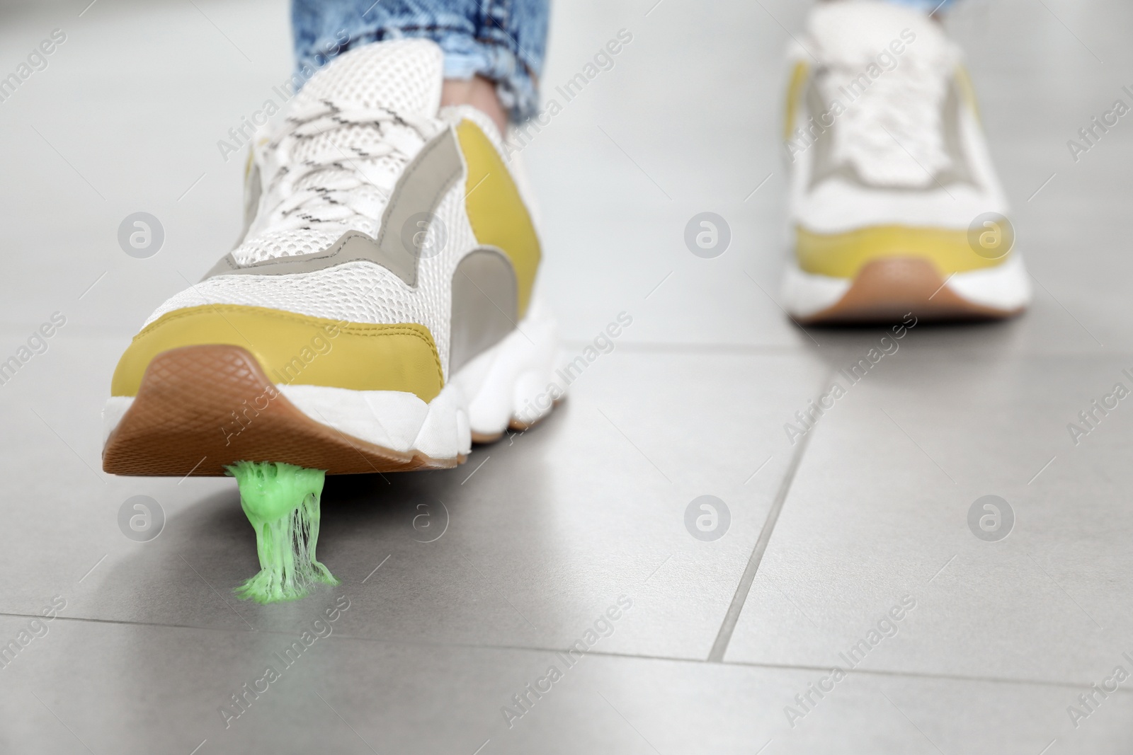 Photo of Person stepping into chewing gum on floor, closeup. Space for text