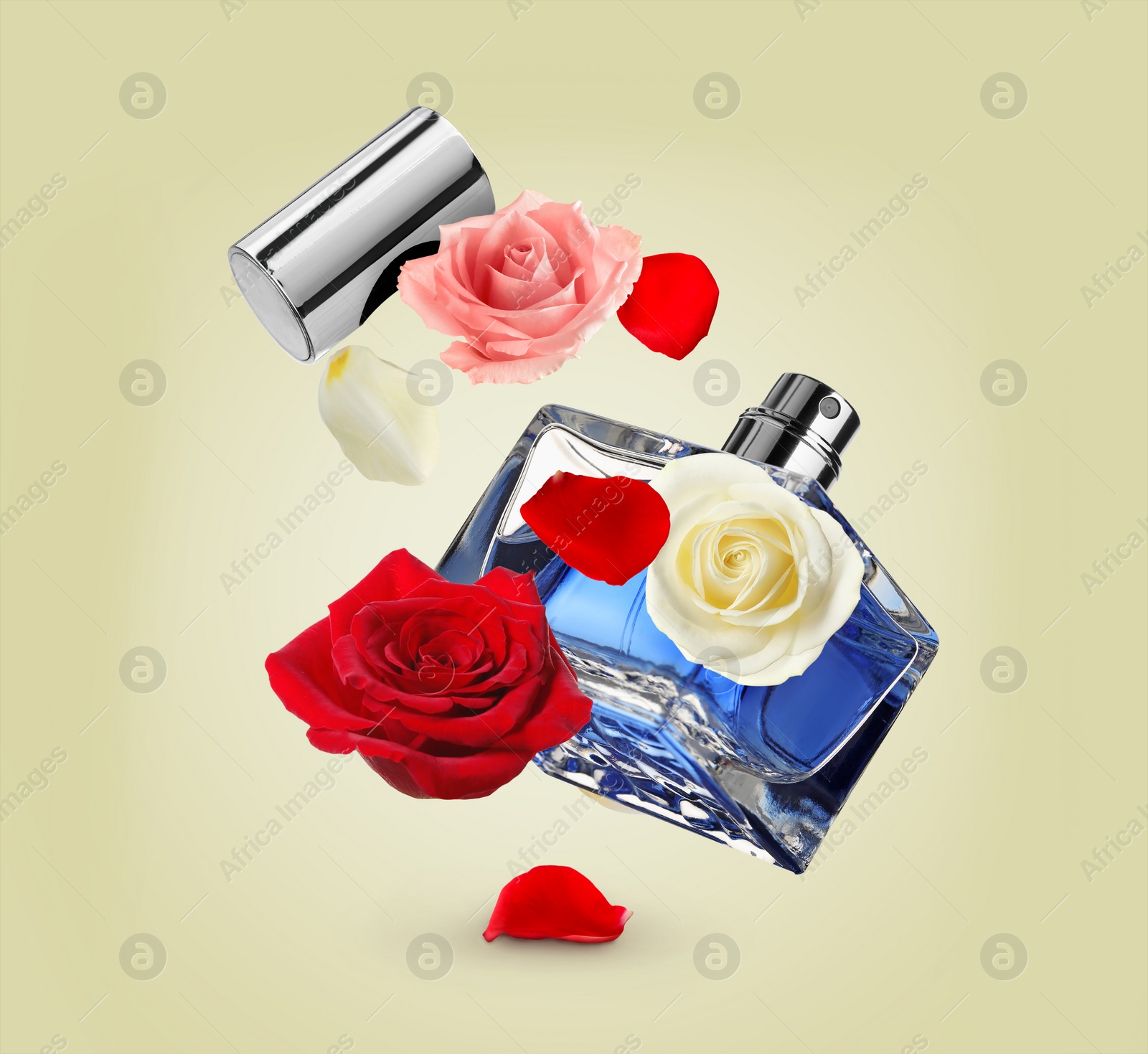 Image of Bottle of perfume and roses in air on pale yellow background. Flower fragrance