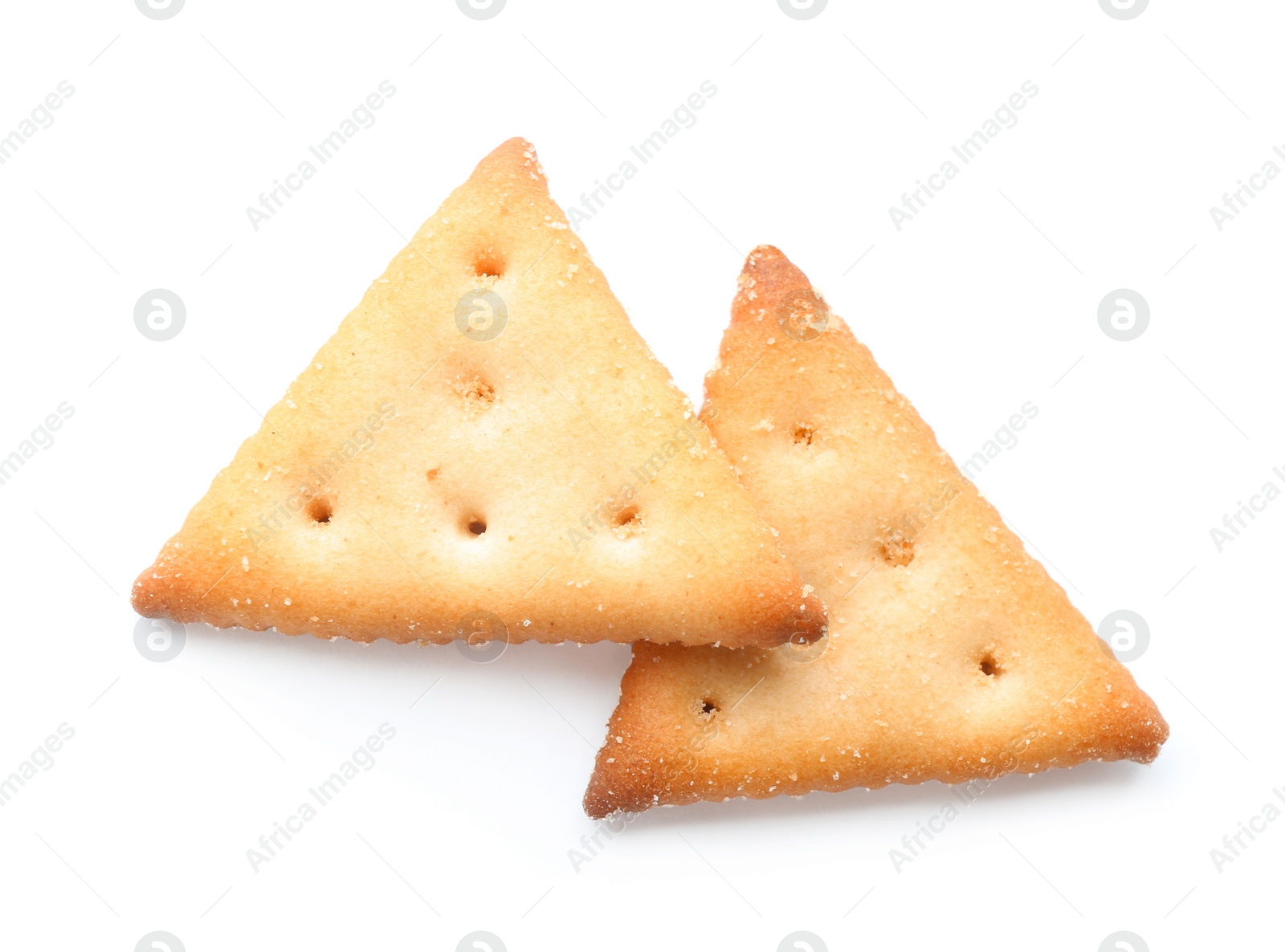 Photo of Crispy crackers isolated on white. Delicious snack