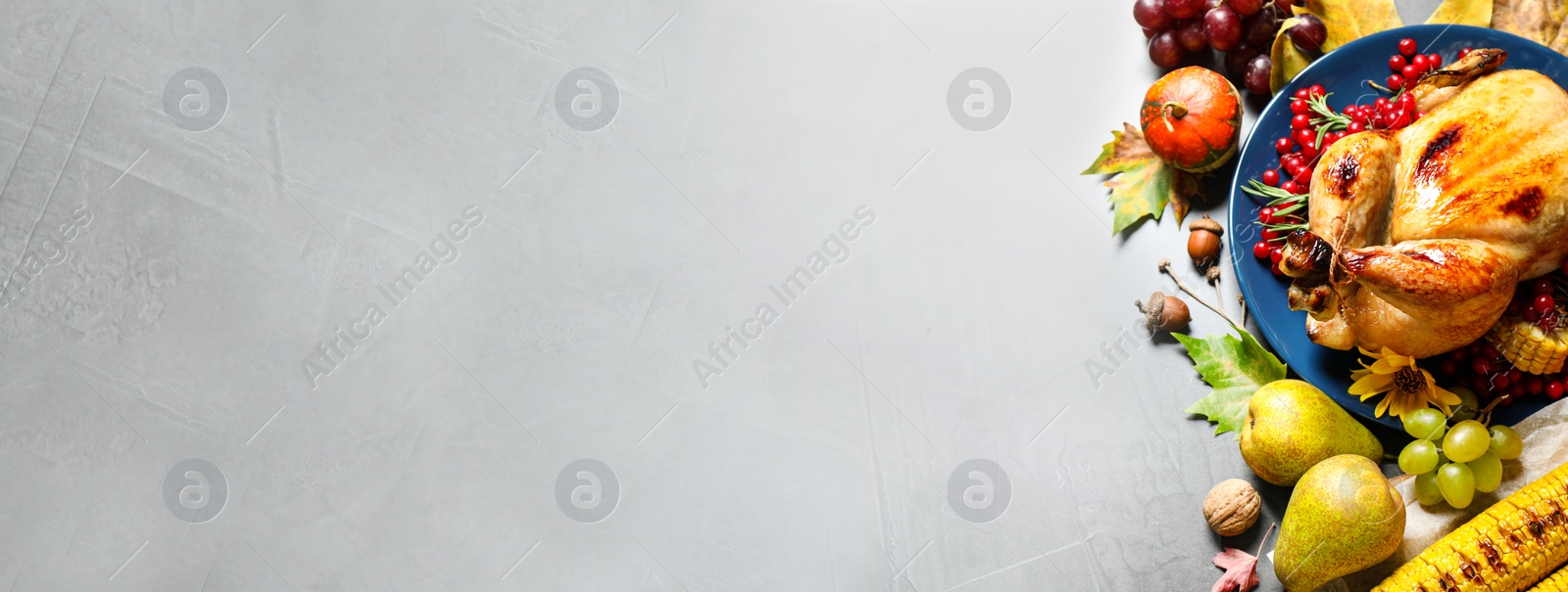 Image of Tasty turkey served on grey table, top view with space for text. Banner design