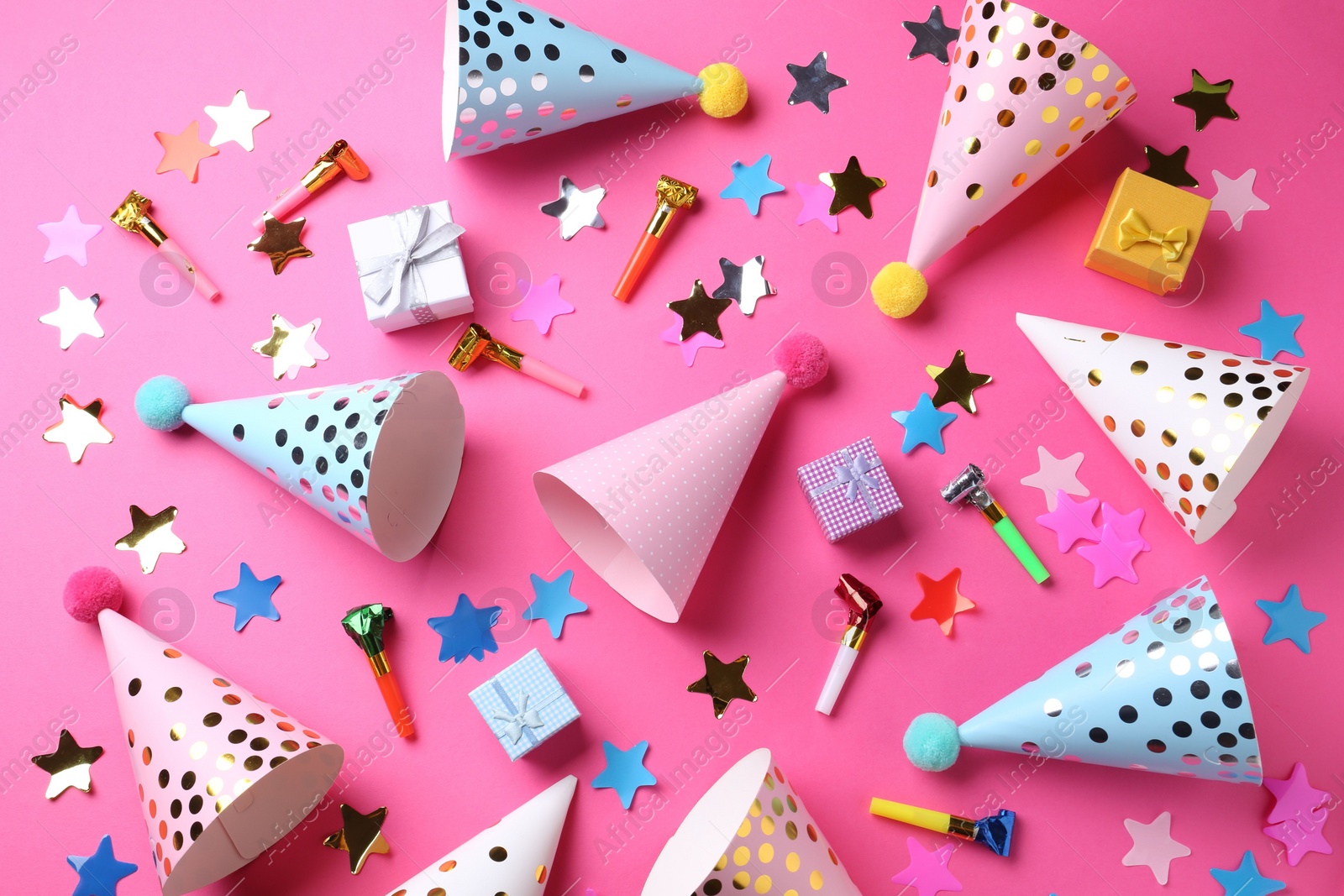 Photo of Flat lay composition with party hats on pink background