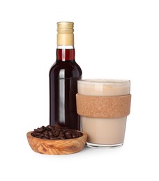 Bottle of delicious syrup, glass of coffee and beans isolated on white