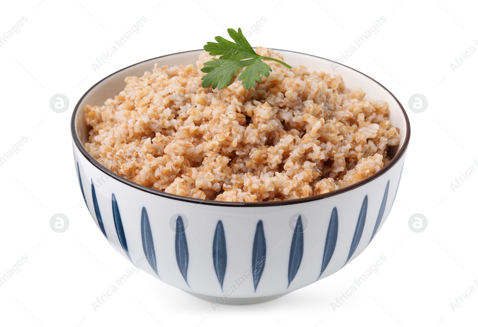 Photo of Tasty wheat porridge with parsley in bowl isolated on white