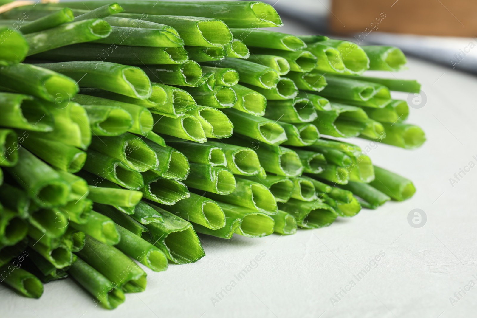 Photo of Fresh green onion on table, closeup