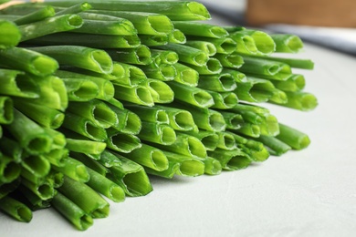 Fresh green onion on table, closeup