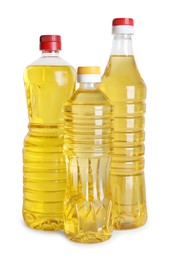 Bottles of cooking oil on white background