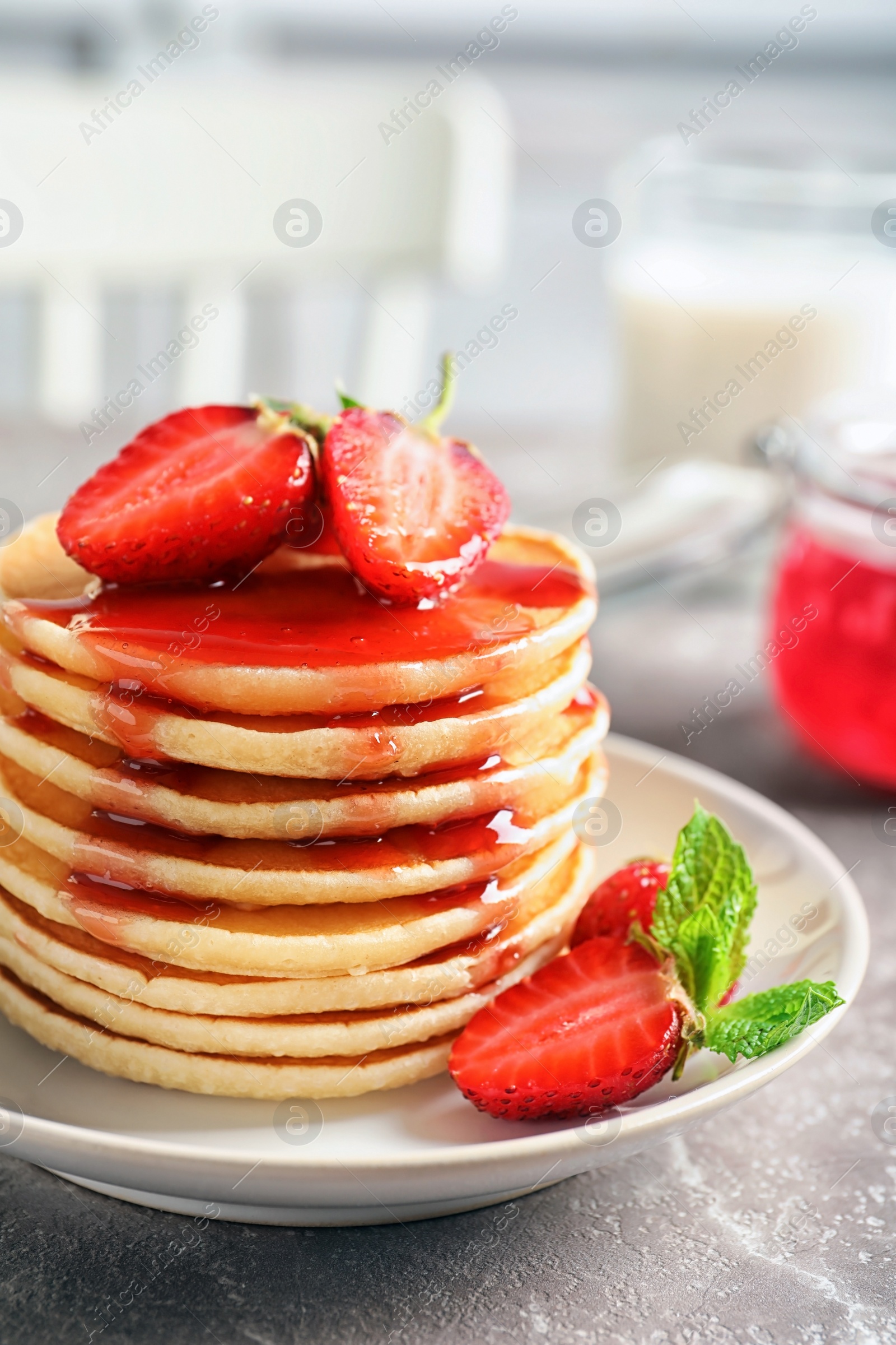 Photo of Plate with pancakes and berries on table, closeup