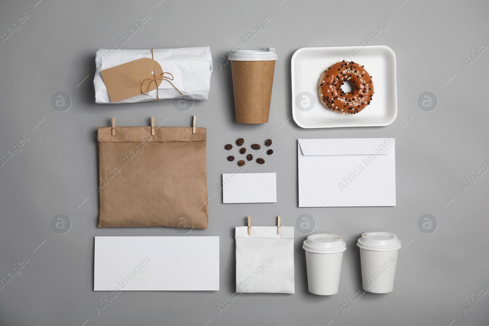 Photo of Flat lay composition with items for mock up design on gray background. Food delivery service