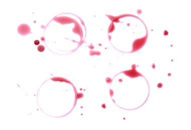 Photo of Many red wine rings and drops on white background, top view