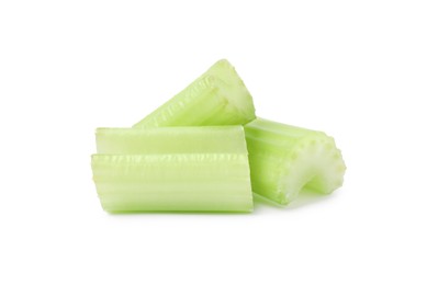 Photo of Pieces of fresh cut celery isolated on white