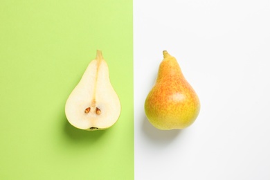 Photo of Ripe juicy pears on color background, top view