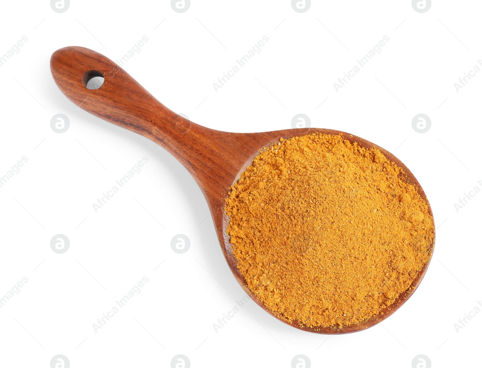 Photo of Curry powder in spoon isolated on white, top view