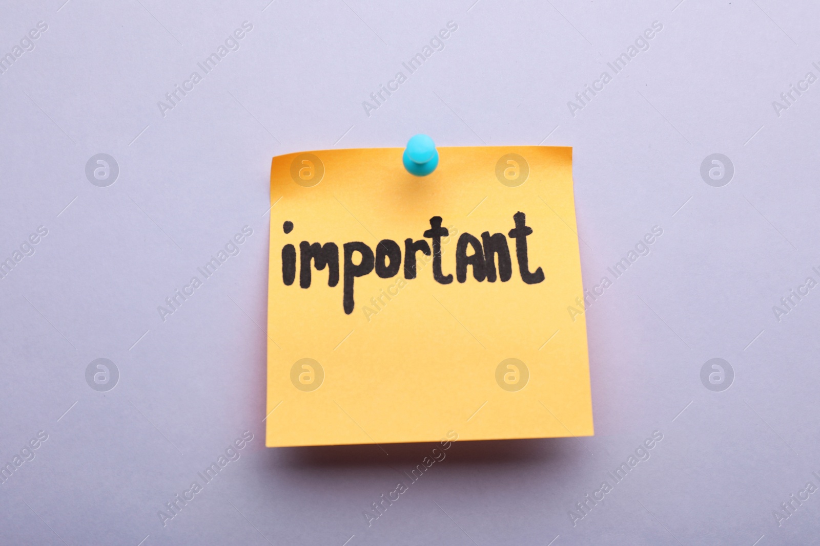 Photo of Paper note with word Important pinned on light grey background