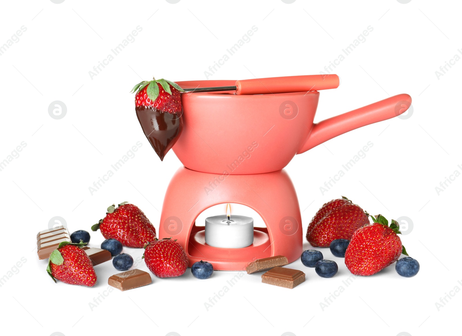 Photo of Fondue pot with chocolate and berries isolated on white