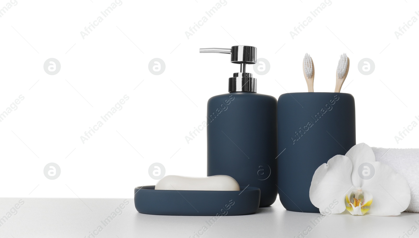 Photo of Bath accessories. Different personal care products and flower on table against white background. Space for text