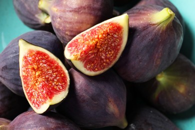 Photo of Many fresh ripe figs on plate, closeup