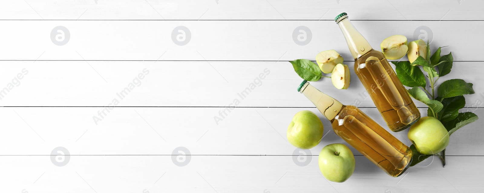 Photo of Flat lay composition with delicious apple cider on white wooden table, space for text