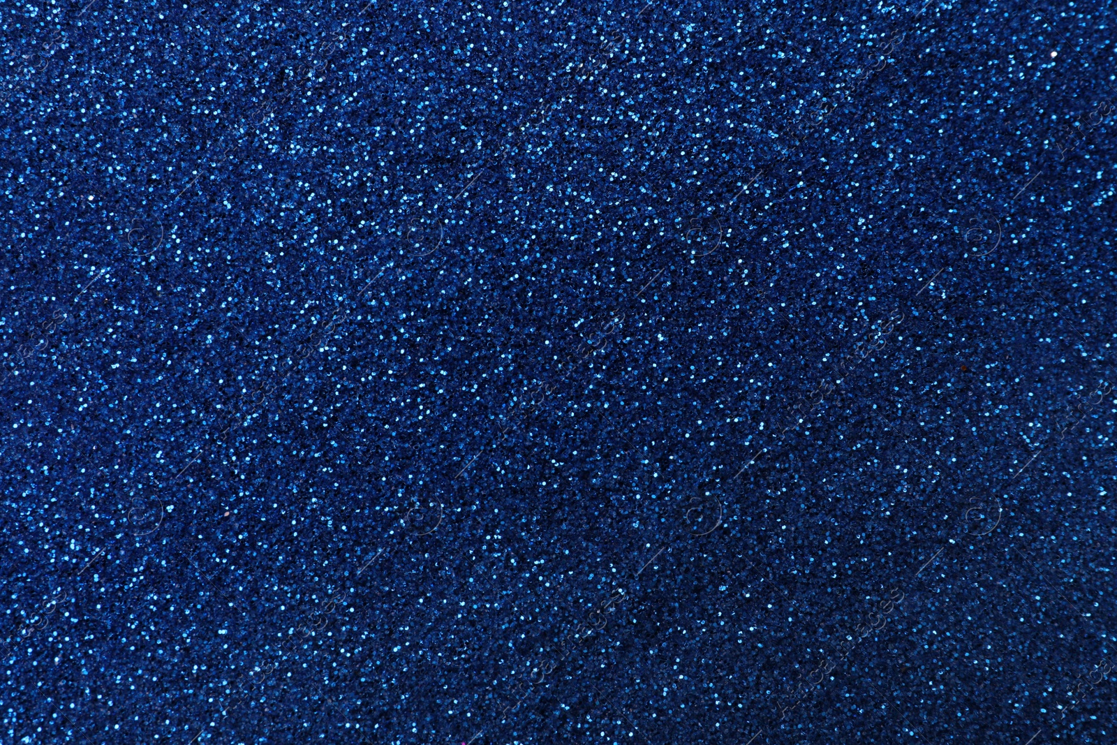 Photo of Beautiful shiny blue glitter as background, closeup