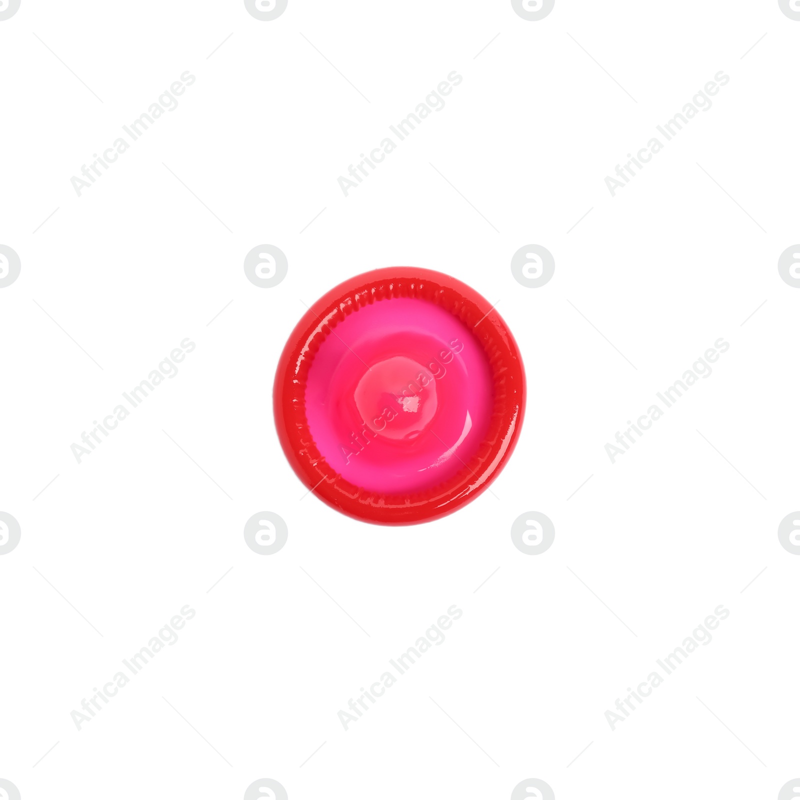 Photo of Unpacked red condom isolated on white, top view. Safe sex