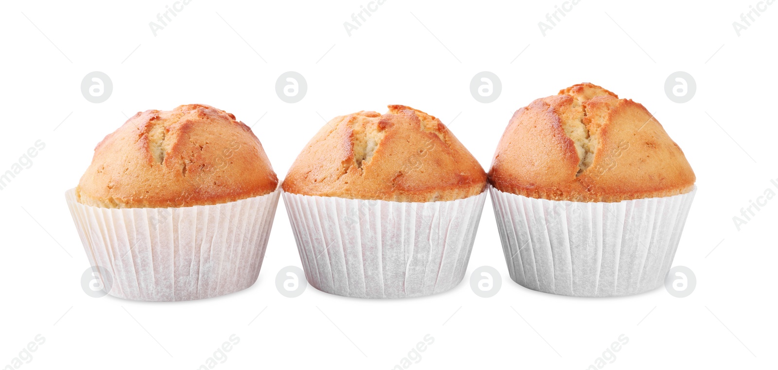 Photo of Tasty muffins in paper cups on white background