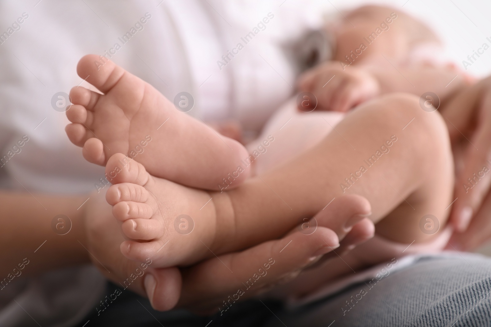 Photo of Mother with her cute baby, closeup view