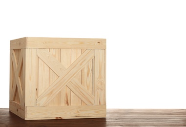 Photo of Wooden crate on table against white background. Space for text