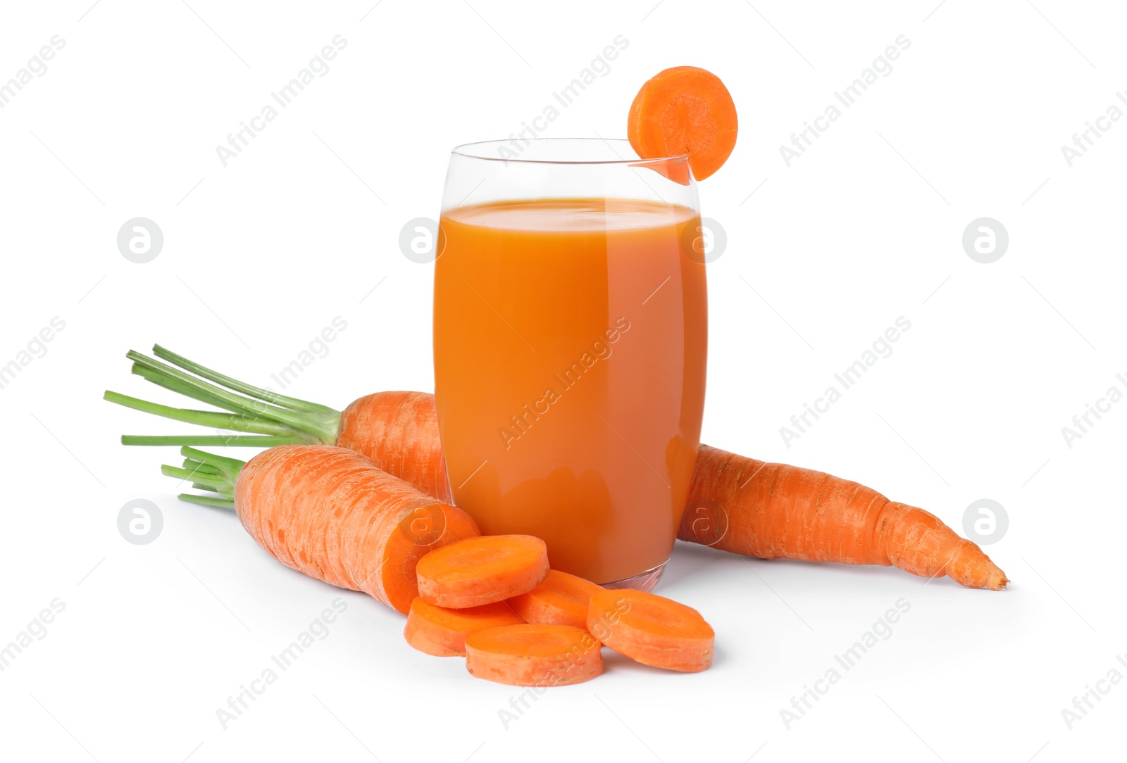 Photo of Freshly made carrot juice in glass on white background