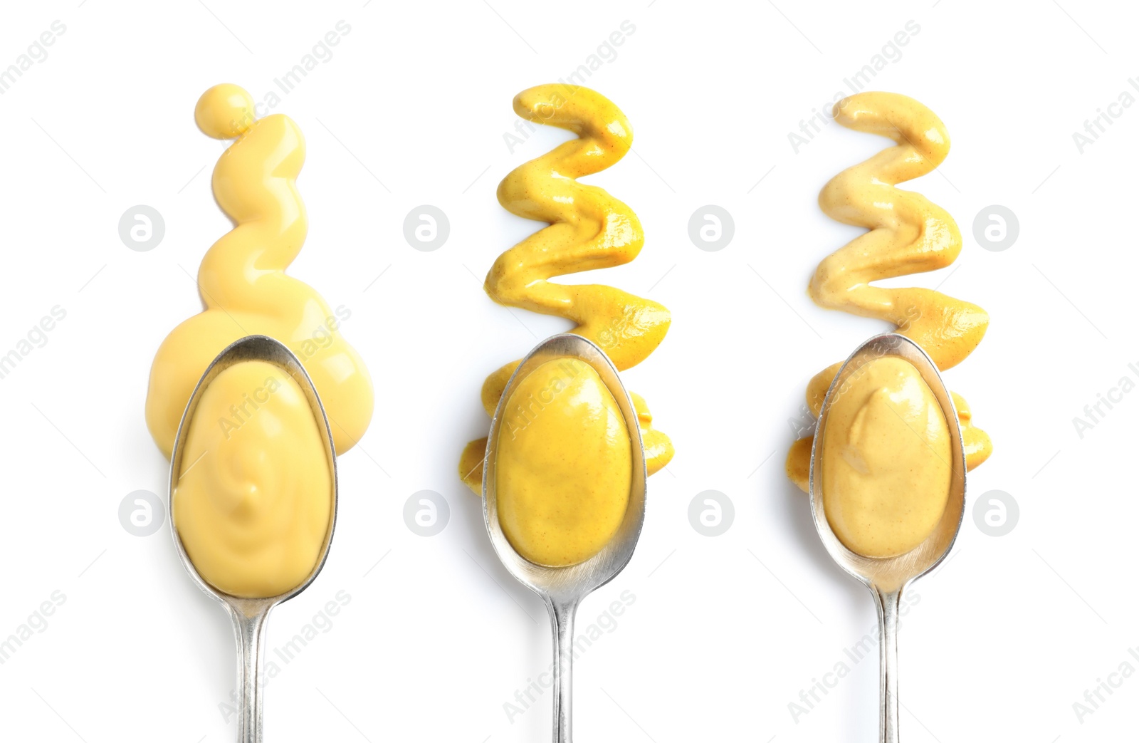 Image of Set of spoons with different delicious sauces on white background, top view