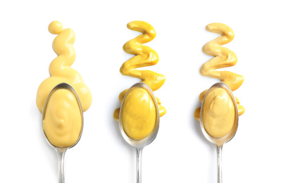 Image of Set of spoons with different delicious sauces on white background, top view