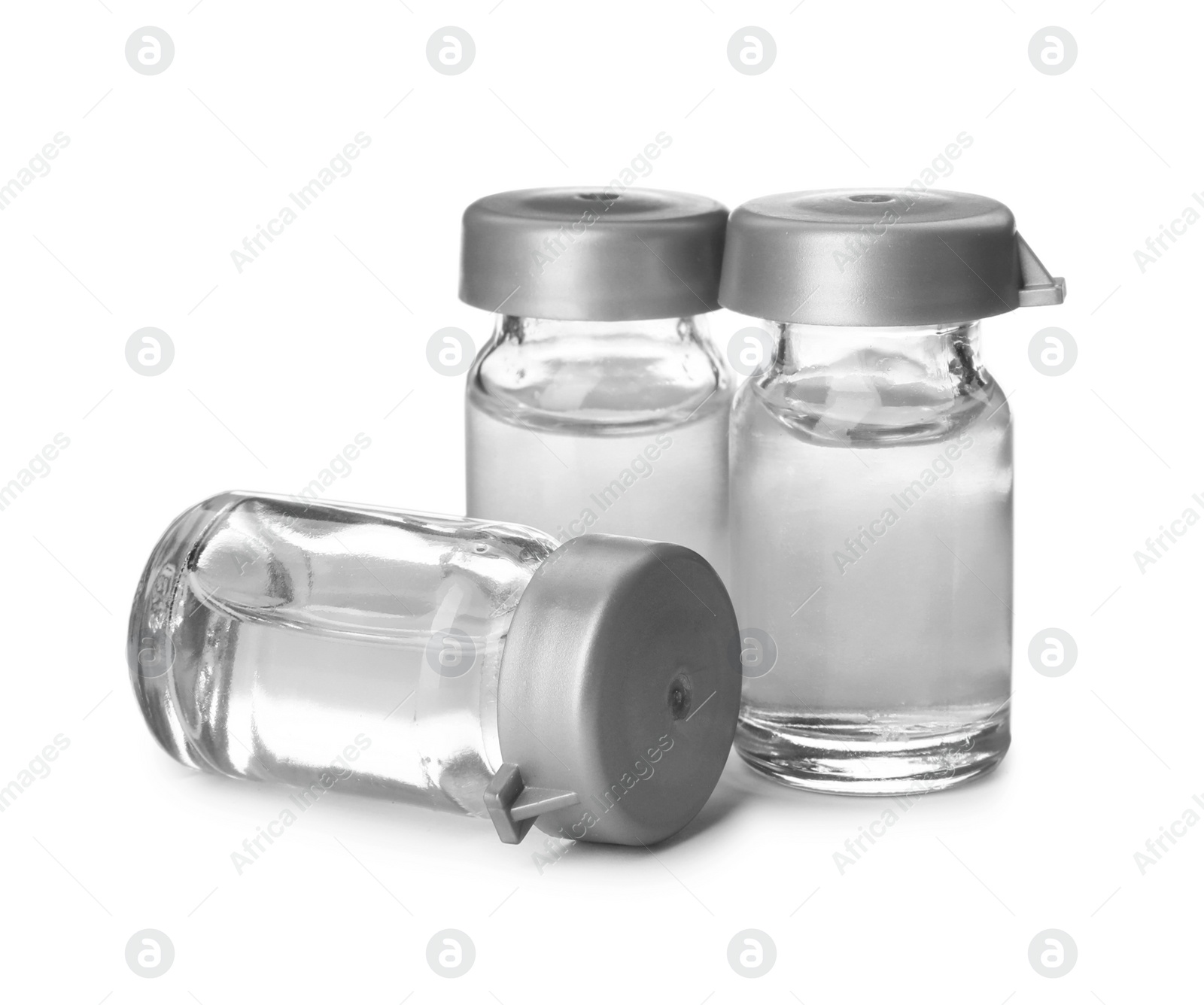 Photo of Medical vials with solution for injection on white background